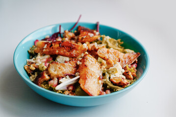 Healthy vegetarian dinner or lunch.  Salad with caramelized grilled pear, walnuts, blue cheese and pomegranate seeds.
