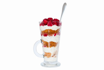 Sweet dessert from biscuits berries and yogurt in transparent tall glass, isolated on white background.