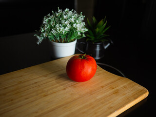 Healthy tomatoes on wooden background top view. Food and health.