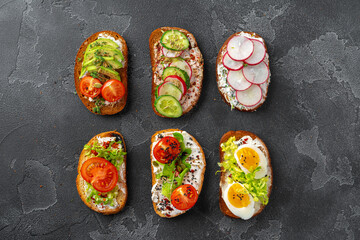 Assortment of vegan sandwiches with avocado and tomatoes