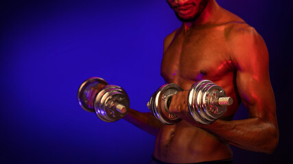 Unrecognizable Athlete Guy Exercising With Dumbbells Standing On Blue Background