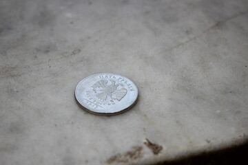 coin on a concrete table