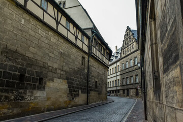 Narrow medieval street with traditional Bavarian houses in Bamberg, Bavaria, Franconia, Germany. November 2014