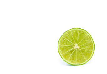 green lemon and slice isolated on white