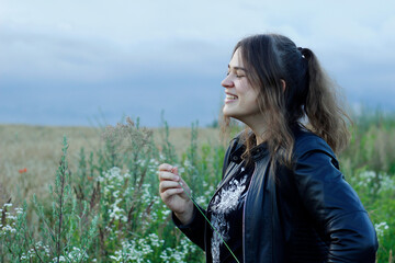 Alternative lifestyle of a woman on the meadow.