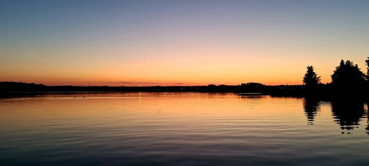 Obraz premium sunset over the river