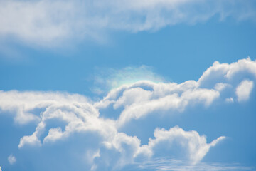 The beauty of the sky with clouds and the sun.