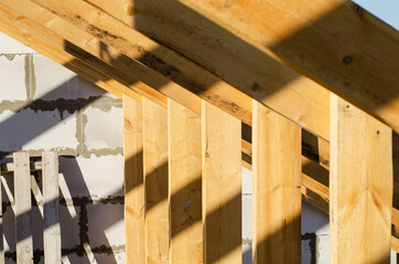 wooden frame of beams for the roof of the house. construction of houses