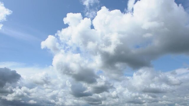 Beautiful cloudy video timelapse. Blue sunny sky with white peaceful clouds changes at cloudy stormy dramatic rainy skyscape.