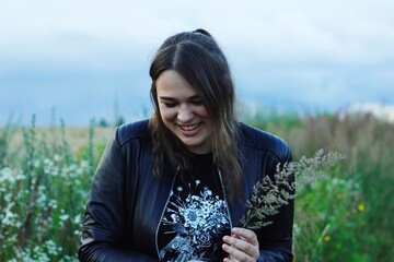 Alternative lifestyle of a woman on the meadow.