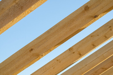 wooden bars against the sky. roof construction