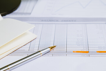 Spreadsheet bank accounts accounting with calculator.Concept for financial fraud investigation, audit and analysis.