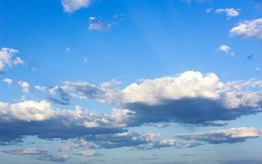 Blue sky with white and gray clouds