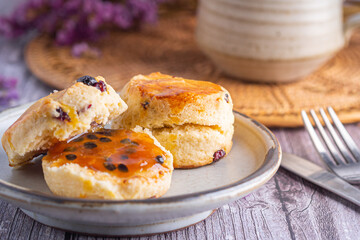 Traditional British scones with a tea cup and blurred background