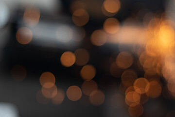 Fototapeta premium Gold abstract bokeh background, Festive xmas abstract background with bokeh defocused lights and stars