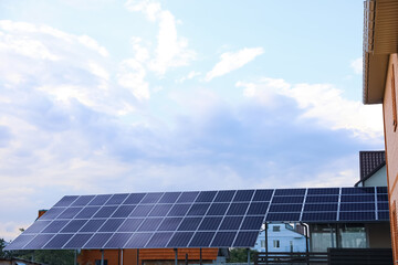 Obraz premium Modern solar panels installed on backyard of cottage