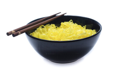 yellow noodles on bowl isolated on white background
