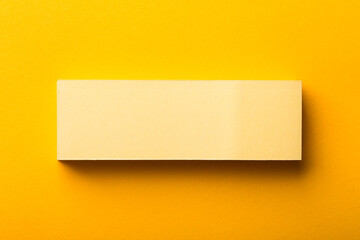 Blank Paper Isolated On Yellow Background