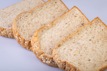 Whole wheat bread isolated on white background. Slice bread, made from 12 kinds of grains, clearly portray the texture and look delicious.