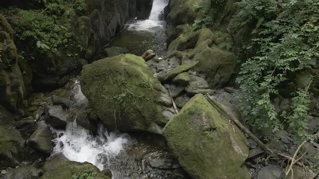 Slow motion drone footage of Stock Ghyll Force waterfall at Ambleside in the Lake District, Cumbria, England, UK