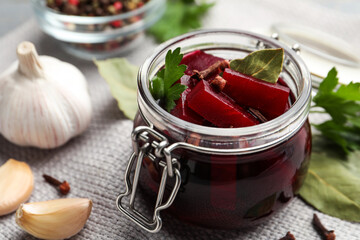 Delicious pickled beets and spices on table, closeup