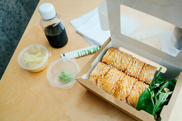 Sushi rolls set in a paper container.