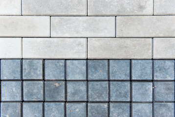 Gray-black smooth rows of paving slabs