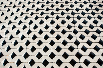 grey-black smooth rows of paving slabs taken from above