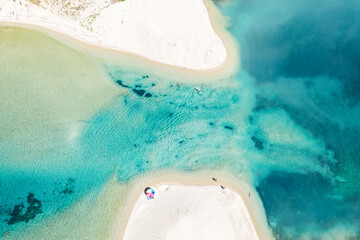 Aerial photo of white beach and blue sea lagoon at Halkidiki peninsula, Greece. Summer background.