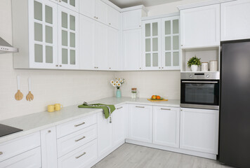 Modern kitchen interior with stylish white furniture