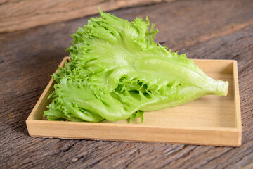 fresh frillice iceberg lettuce on wooden background