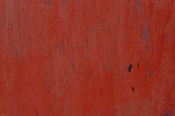 red scuffed the surface of the metal sheet