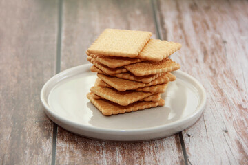 square dry sweet cookies with decorative a ornaments