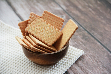 square dry sweet cookies with decorative a ornaments