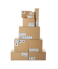 Stack of cardboard boxes with different packaging symbols on white background. Parcel delivery