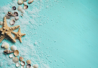 Fototapeta na wymiar Creative flat lay concept of summer travel vacations. Seashells and starfish on turquoise blue background.