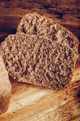 Sliced Homemade wholemeal bread with butter. Easy Cooking of healthy bread from alternative flours