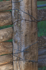 wood barbed wire fence
