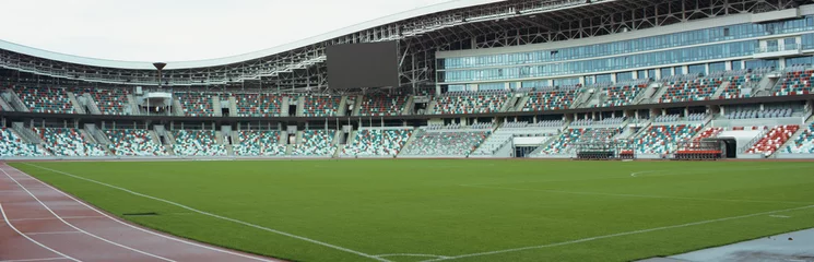 Fotobehang WIDE View of empty stadium seats before game or during Coronavirus COVID-19 pandemic © supamotion