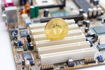 Golden Bitcoin on the circuit board