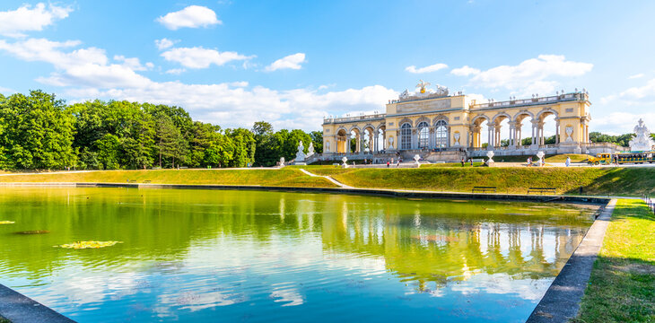 VIENNA, AUSTRIA - 23 JULY, 2019: The Gloriette in Schonbrunn Palace Gardens, Vienna, Austria. Front view and water reflection