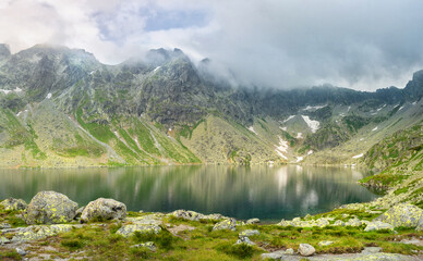A valley in the mountains with the Hincovo pleso pond in the High Tatras.