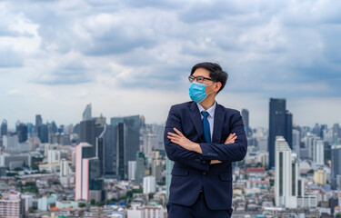 Fototapeta na wymiar Young businessman wear masks to prevent dust and toxic pollution from the air, smoke and viral diseases,Perspectives on the future and success
