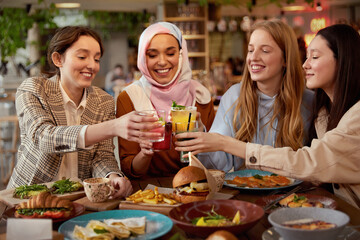 Lunch. Women In Cafe Portrait. Group Of Smiling Multi-Ethnic Girls Cheering With Cocktails. Friends Meeting In Restaurant As Part Of Lifestyle.