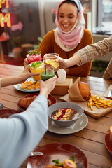 Lunch. Women Cheering With Cocktails In Cafe. Girls Having Fun. Friends Meeting In Restaurant As...