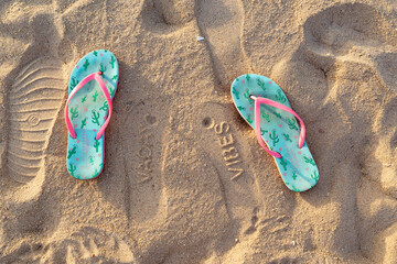 Hurghada / Egypt - July 20, 2019: Flip flop on a sandy ocean beach
