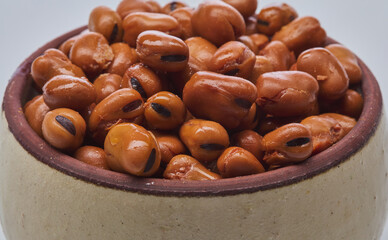 Fava beans (foul) shot on white background.