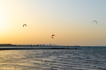 Kiters gliding over the Red sea surface. Extreme outdoor sport/activity/recreation. People in sport...