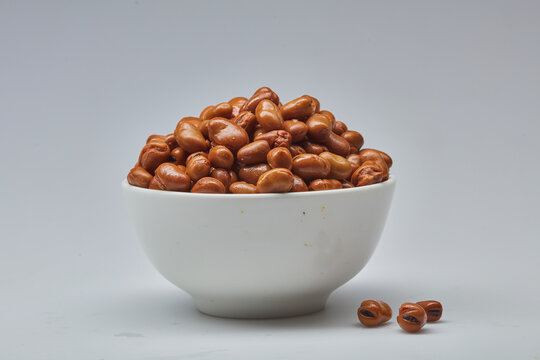 Fava beans (foul) shot on white background.