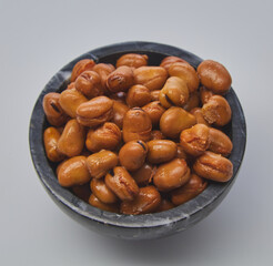 Fava beans (foul) shot on white background.